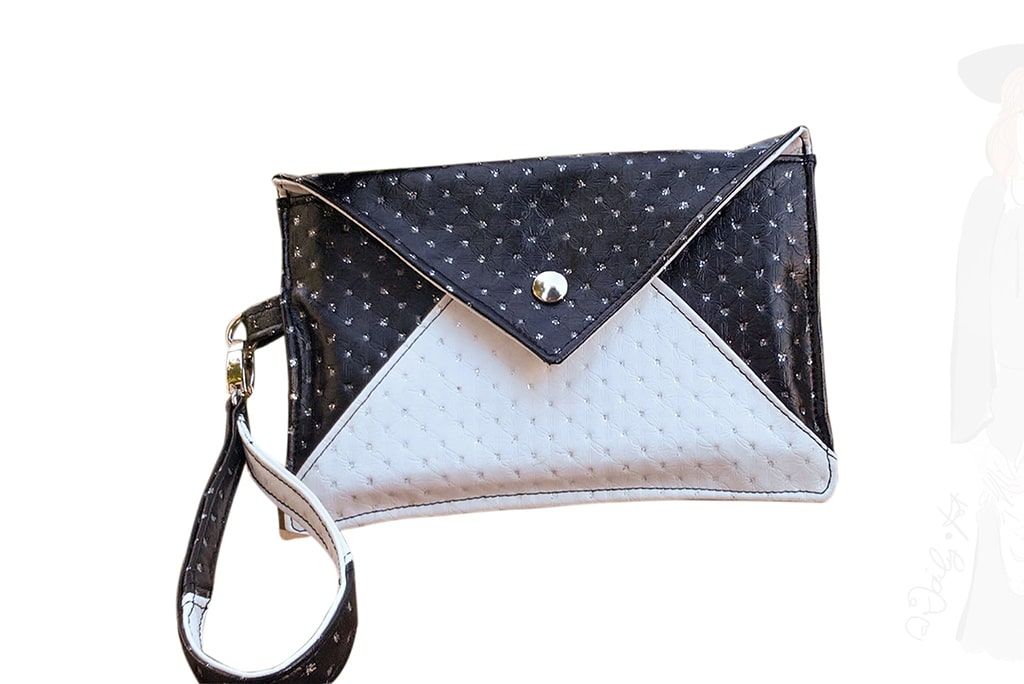 Style black & white pour cette pochette de réveillon noire et blanche avec des minipaillettes