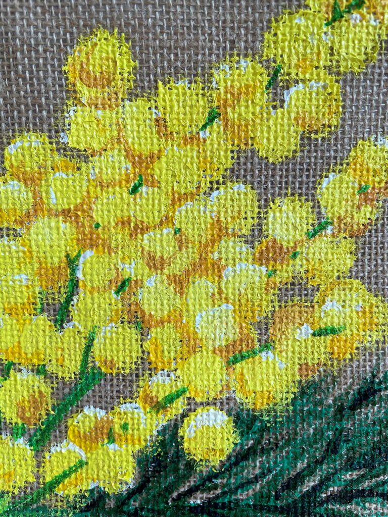 Peinture de mimosa jaune sur un sac en toile de jute